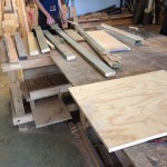 Greg inspects some of the available lumber